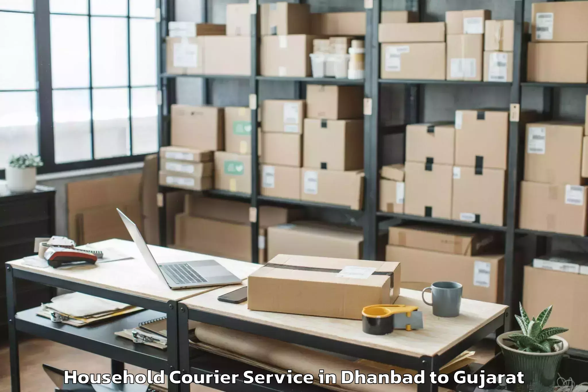 Trusted Dhanbad to Veer Narmad South Gujarat Univ Household Courier